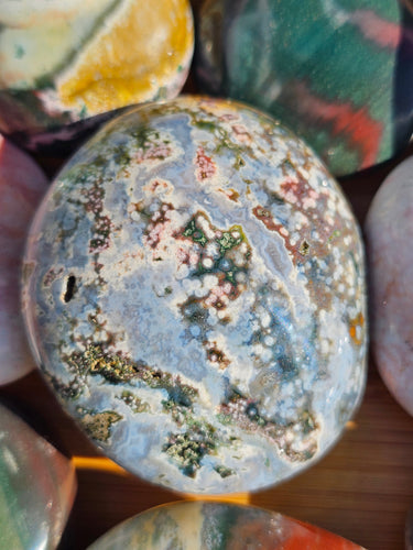 ocean jasper palm stone polished crystal with orb-like patterns