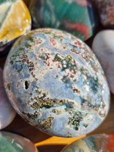 Load image into Gallery viewer, ocean jasper palm stone polished crystal with orb-like patterns
