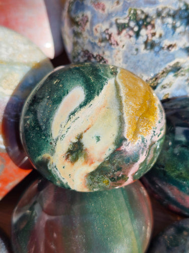 ocean jasper palm stone polished crystal in blue green pink colours