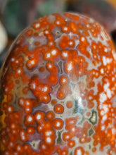 Load image into Gallery viewer, close up of ocean jasper palm stone with orbicular patterns
