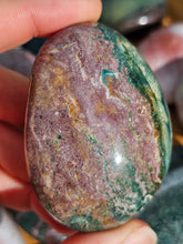 Load image into Gallery viewer, hand holding ocean jasper palm stone for meditation

